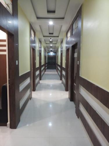 a corridor in a building with at HOTEL R K RESIDENCY MUZAFFARPUR in Muzaffarpur