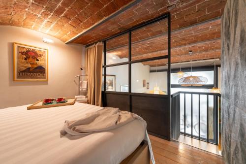 Katil atau katil-katil dalam bilik di Via Cimabue 8b - Florence Charming Apartments - Metropolitan Loft in Florence - 20 minute walk to city center - excellent base for exploring - less than 5 minute walk to the supermarket - amazing bakery on the corner