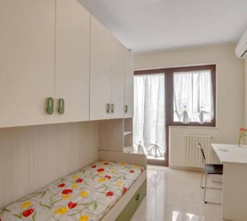Postel nebo postele na pokoji v ubytování L’orchidea rooms, cucina e bagno in comune