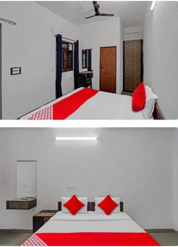 ノイダにあるHotel The Grand Shivaのベッドルーム(赤い枕の大きな白いベッド付)