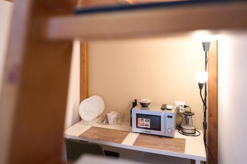 a microwave sitting on a counter in a room at Toto e Peppino Luxury Rooms in Naples