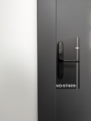 a close up of a refrigerator door with a magnet at No Stars - Premium Hotel Apartments in Ioannina
