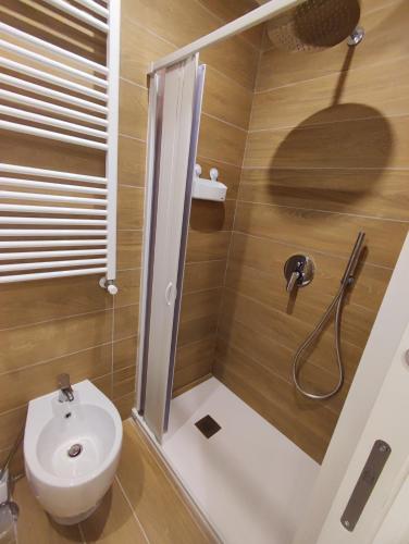 a bathroom with a shower with a toilet and a sink at Duchessa Ravaschieri bed and breakfast in Naples