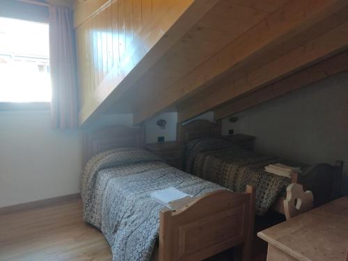 Postel nebo postele na pokoji v ubytování Appartamenti Meoti