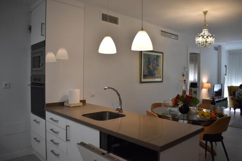 a kitchen with a sink and a counter top at Precioso piso en el centro de Almeria in Almería
