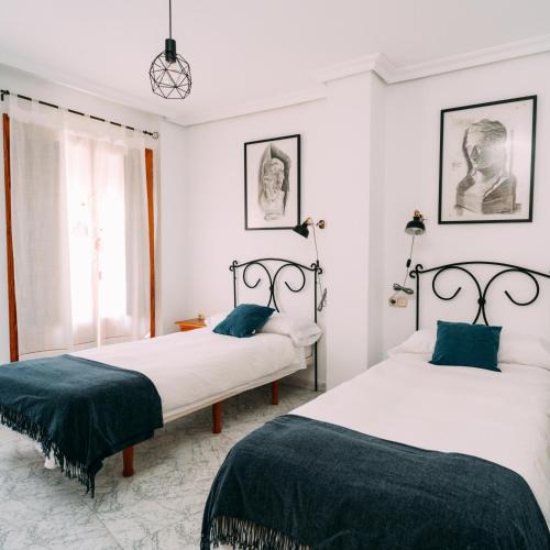 Ένα ή περισσότερα κρεβάτια σε δωμάτιο στο LOS VEINTE BALCONES