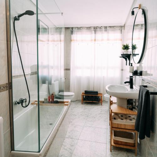a bathroom with a shower and a sink at LOS VEINTE BALCONES in Caravaca de la Cruz