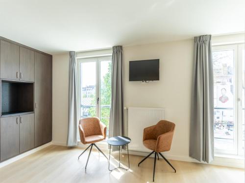 TV a/nebo společenská místnost v ubytování Lace Hotel