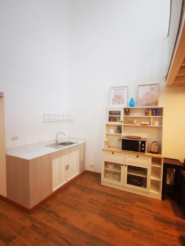a kitchen with a sink and a counter top at Proud Room & wifi in North Pattaya