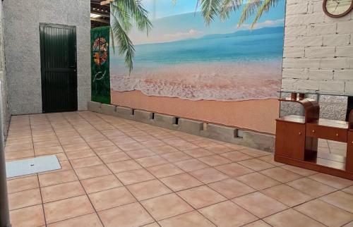 a room with a painting of the beach at BYP in Ribadumia