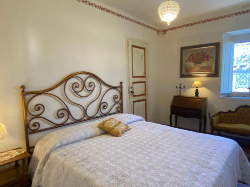 Un ou plusieurs lits dans un hébergement de l'établissement B&B La Rocca