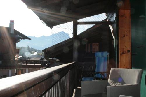 a view of a train station with a chair at Chalet la Griotte in Villars-sur-Ollon