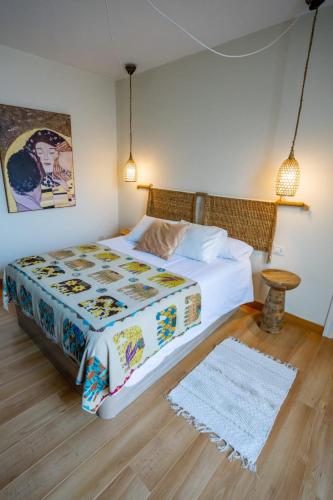 a bedroom with a large bed and a table at Casa Lula in El Médano