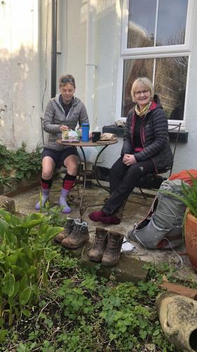 a man and a woman sitting at a table at Komorebi Healing House in Dawlish