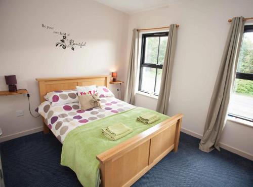 a bedroom with a bed and a window at The Lamb & Flag in Glyn Neath