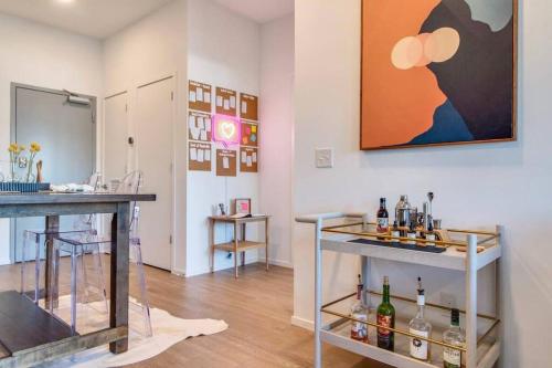 a room with a counter with bottles on it at Stylish downtown condo w/ pool & parking in Nashville