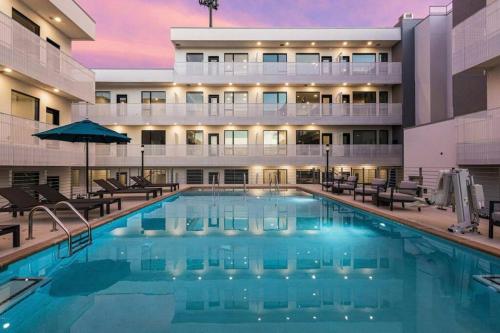 a swimming pool in front of a hotel at Stylish downtown condo w/ pool & parking in Nashville