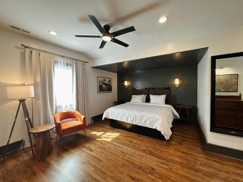 a bedroom with a bed and a ceiling fan at The Opal and West House in Shelby