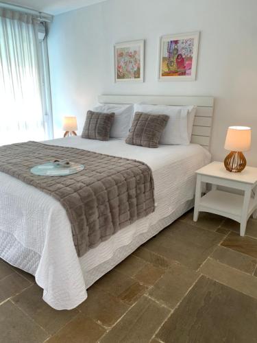 Кровать или кровати в номере Guest House Guarujá Hotel Boutique