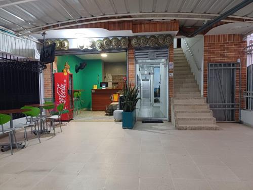 a room with a staircase and a brick building with a door at Hotel Casa Martina Valledupar in Valledupar