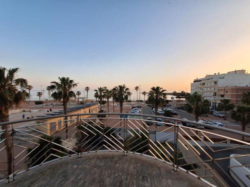 a view of a city with palm trees and a street at APARTAMENTOS SAN NICOLAS in Adra