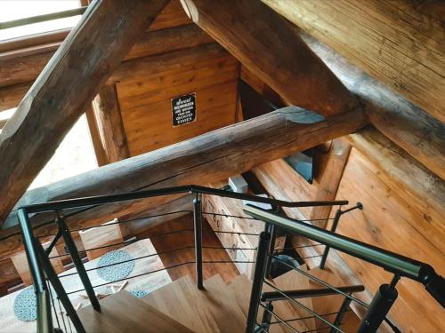 an overhead view of a staircase in a wooden attic at Dřevěný romantický srub v Krušných horách in Hroznětín