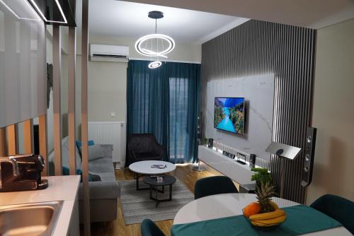 a living room with a couch and a table at Diamond 72 apartment , Skopje City - Center, Diamond Residences, free parking in Skopje