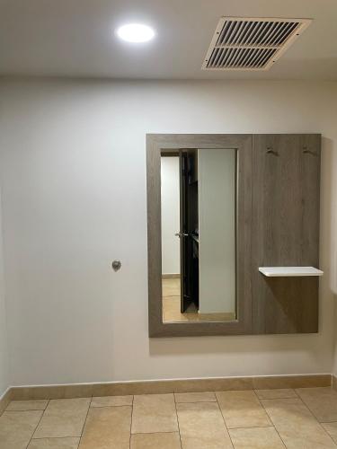 a mirror on a wall in a room at Holiday Inn Express Mérida by IHG in Mérida