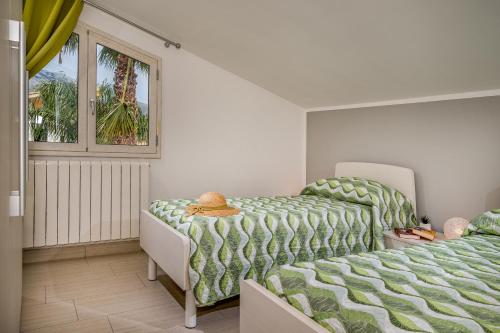 Un pat sau paturi într-o cameră la Villa Jacqueline con piscina privata 8 posti letto