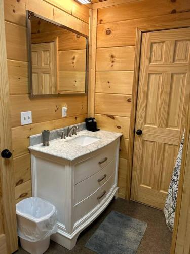 a bathroom with a sink and a toilet in a cabin at Easy Living in Gatlinburg in Gatlinburg