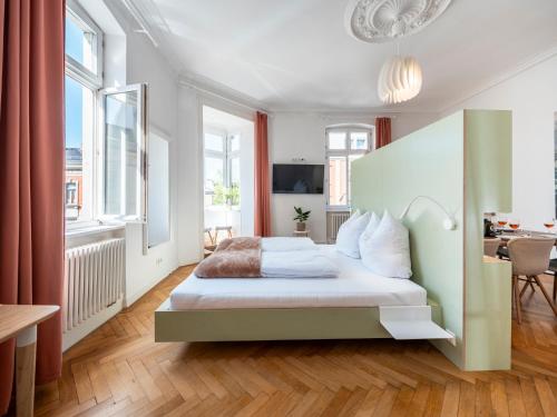 Ένα ή περισσότερα κρεβάτια σε δωμάτιο στο Bunter Hund Apartments - NEU, Zentral, Geräumig
