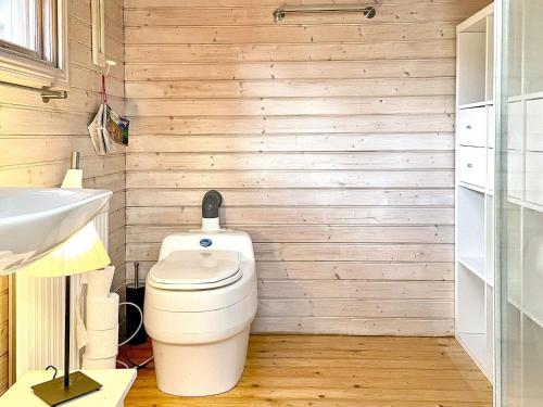 a bathroom with a toilet and a sink at 8 person holiday home in FAGERHULT-By Traum in Fagerhult