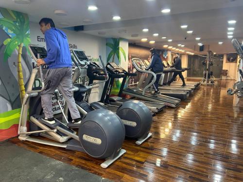 a group of people on treadmills in a gym at Islamabad Oasis Residences in Islamabad