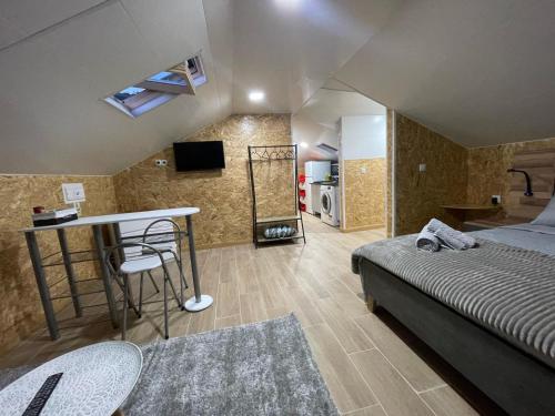 a bedroom with a bed and a table in a room at Dream Home in Calheta