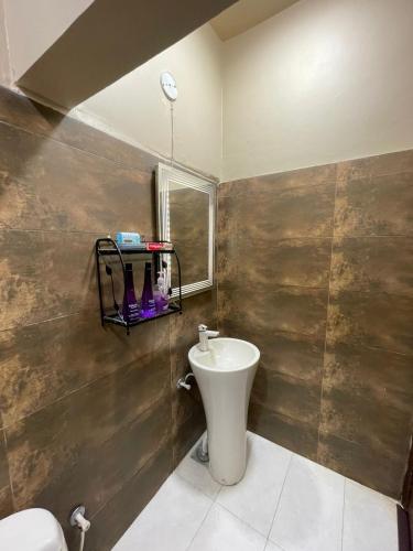 a bathroom with a sink and a toilet at Cozy 2-Bed Portion at Gulshan Iqbal blk 7 in Karachi