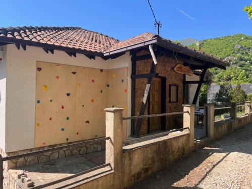 a building with a wall with a climbing wall at Canyon View Lodge - Matka in Matka