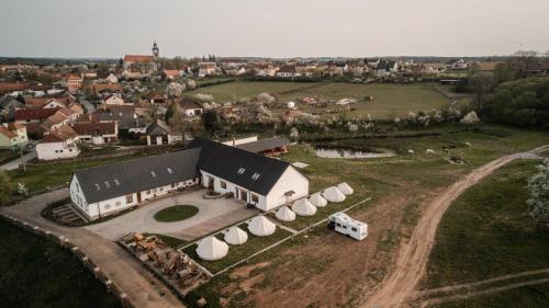 an aerial view of a farm with a large building at Farma Tasov in Velké Meziříčí