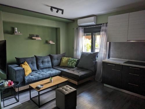 a living room with a couch and a table at Tsitsipas Apartment in Alexandroupoli