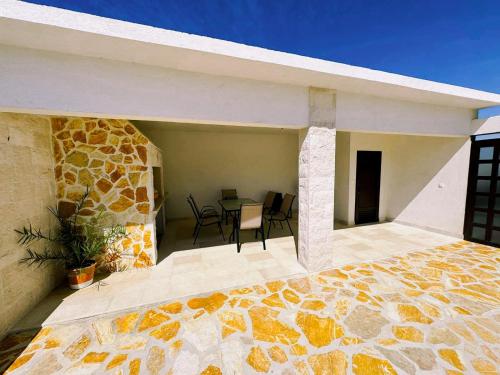 a balcony of a house with a table and chairs at Green paradise in Marina