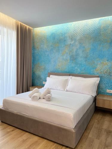 Кровать или кровати в номере EMAR Beachfront Hotel Ksamil