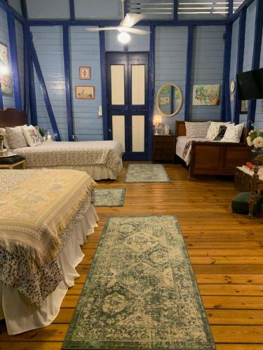 a room with two beds and two rugs in it at Campito Loving in Higuey