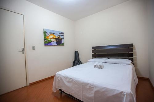 A bed or beds in a room at Foz Temporada