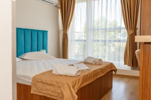 Postel nebo postele na pokoji v ubytování ASTORIA Patria