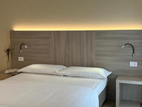 Voodi või voodid majutusasutuse Bernina Suites - vicino al Bernina Express toas