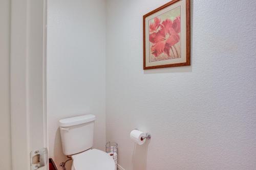 a bathroom with a toilet and a picture on the wall at Las Vegas Home with Mtn Views 13 Mi to the Strip! in Las Vegas