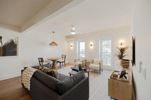 a living room with a couch and a table at The Lumina at The Tarrymore in Wrightsville Beach