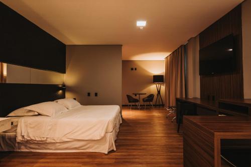 Catuai Hotel Cacoalにあるベッド