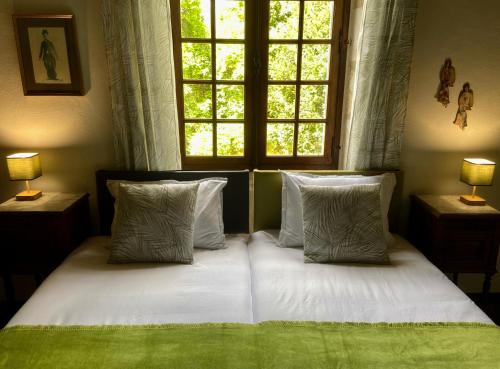 Postel nebo postele na pokoji v ubytování Maison Parmi Les Bambous
