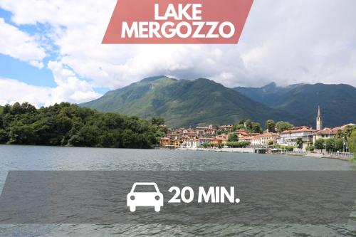 a sign that says take merocco with a car on the water at Ottavio's House, 10min from Maggiore Lake in Ornavasso