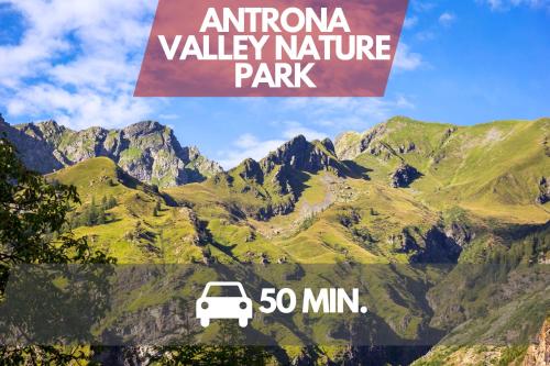 a sign that reads antino valley nature park with a white car at Ottavio's House, 10min from Maggiore Lake in Ornavasso